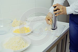 Person Grating Cauliflower With a Grater