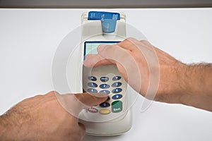 Person Hand Entering Code In A Card Reader