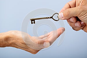 Person Hand Giving Home Key To A Client