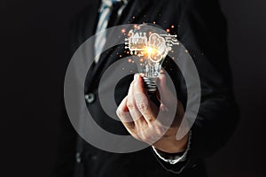 person hand holding power lightbulb and chip ai with brain icon, inspiration, creativity and imagination concept, innovation