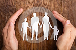 Person Hand Protecting Family Papercut