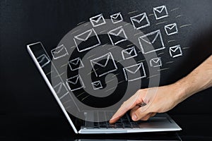 Person Hand Sending The Email From Laptop