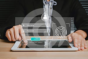 Person hand typing on digital tablet with login and password and fingerprint on screen display, cyber security concep