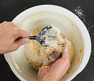 Person handling a sticky dough