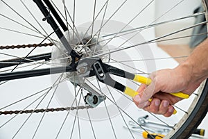 Person Hands Fixing Bicycle Wheel