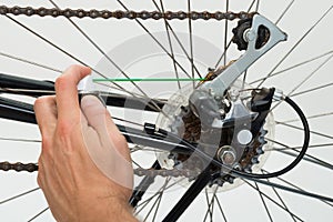 Person Hands Lubricating Bike photo