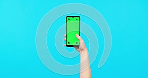 Person, hands and phone mockup for social media, advertising or marketing against a blue studio background. Hand holding