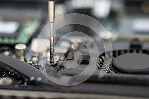 Person Hands Repairing Laptop Motherboard