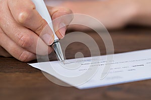 Person Hands Signing Cheque