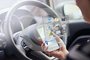Person, hands and smartphone with hologram in car with digital maps for smart driving and assist with navigation. Woman
