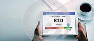 Person, hands and tablet with good credit score in finance, banking or investment above on mockup at office. Top view of
