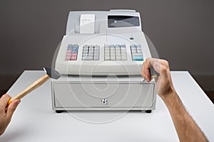 Person Hands With Worktool And Cash Register photo