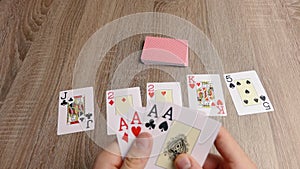 A person has 4 aces in a card game