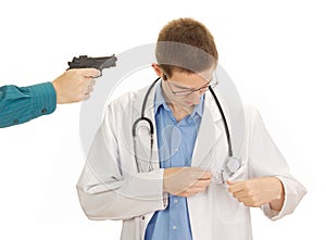 A person hold the young doctor at gunpoint photo