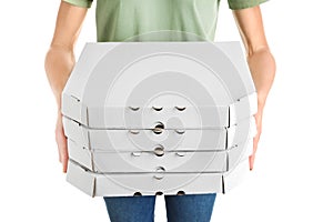 Person holding cardboard pizza boxes on white background