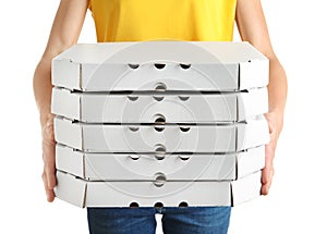 Person holding cardboard pizza boxes on white background