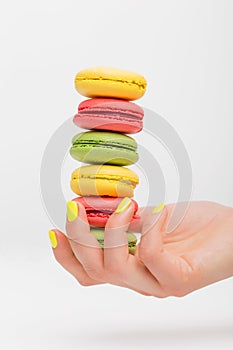 Person holding different macaroons