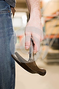 Person holding a hammer