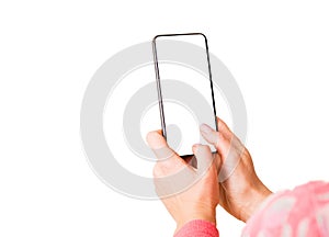 Person holding in hands and typing something on mobile phone with blank white screen