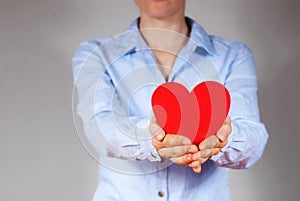 Person holding a heart