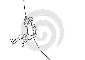 A person holding a line for climbing a wall. One continuous line of climber with rope. Energetic young man climb up across wall. photo