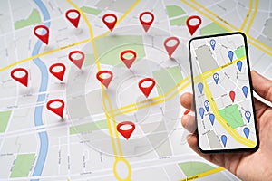 Person Holding Mobile Phone Against Map With Navigation Icons