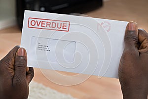 Person Holding Overdue Notice