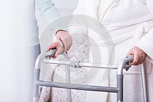 Person holding walking zimmer photo