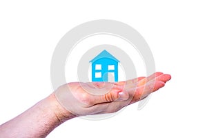 Person holds blue house isolated on white background