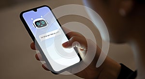 Person interacting with ai chatbot on smartphone screen