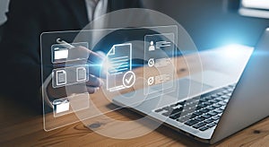 Person interacting with digital document interface on laptop digital interface document management