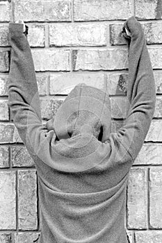 Person in jacket against wall