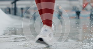 Person, legs and running in water splash, fitness or outdoor workout for cardio exercise or training. Closeup of active