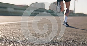 Person, legs and start on road for running, fitness or outdoor cardio exercise in urban town or city. Closeup of athlete