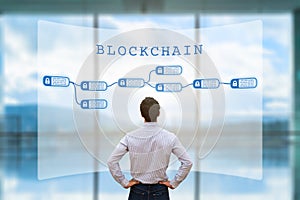 Person looking at blockchain concept on screen, cryptocurrency, business, fintech