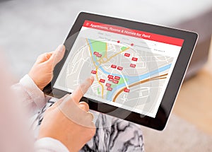 Person looking for places to stay on digital tablet app