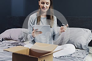 Person making online order sitting at home. Easy to understand app for mobile devices. Shipment of high quality goods worldwide