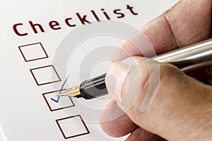 Person Marking in a Checkbox on white paper.