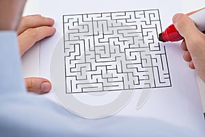 Person With Maze On Paper