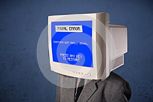 Person with a monitor head and fatal error blue screen