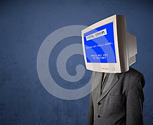 Person with a monitor head and fatal error blue screen on the di