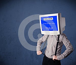 Person with a monitor head and fatal error blue screen on the di