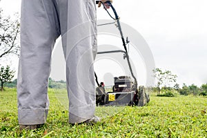 Person mowing a lawn