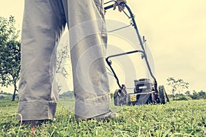 Person mowing a lawn