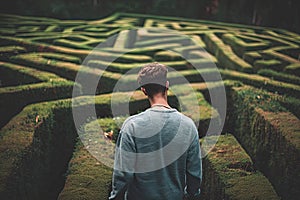 person navigating a maze or labyrinth, symbolizing problem-solving and strategy