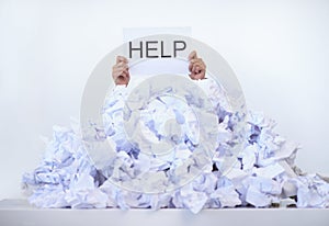 Person, office and hands with pile of paperwork, sign and help with burnout, stress and administration. Debt, bills and