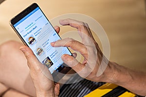 Person ordering food online via app on smart phone
