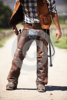 Person, outdoors and gun ready to shoot for standoff or gunfight in duel for wild western culture in Texas. Cowboy