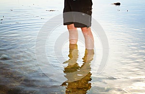 Person paddling in sea