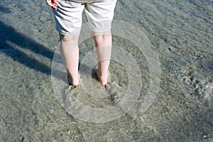 Person paddling in sea